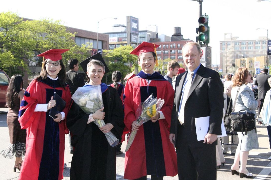 Shuang Liu, Professor Barbara Di Eugenio, Jack Xie, and Professor Pete Nelson at graduation