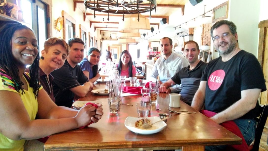 Eight NLP Lab members around a table at lunch