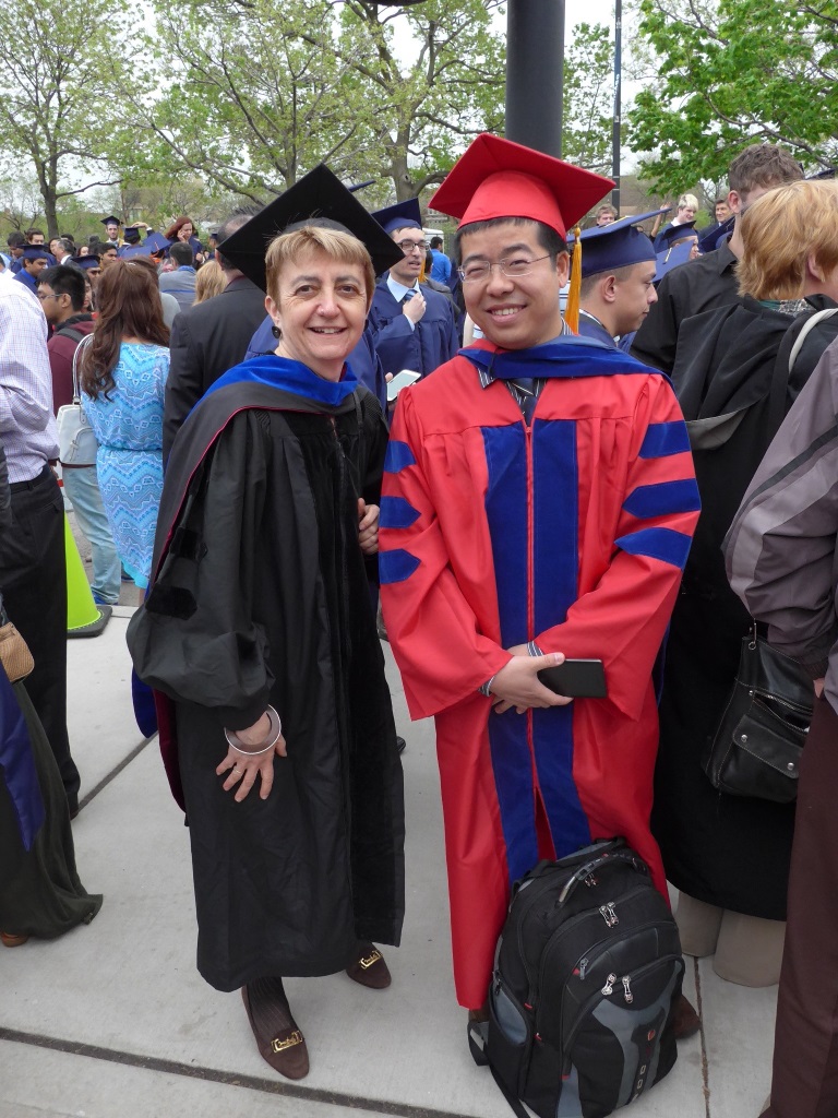 Professor Di Eugenio and Lin outdoors in graduation regalia