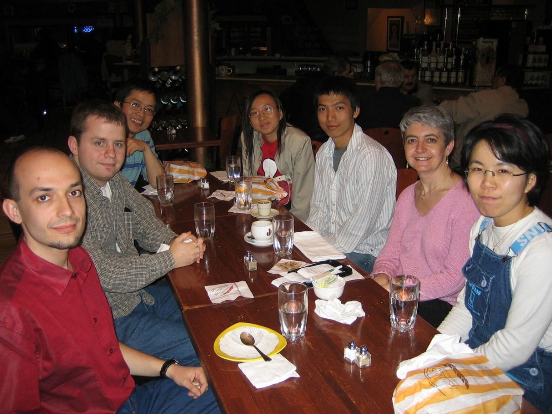 Several NLP Lab members around a table in a restaurant for dinner