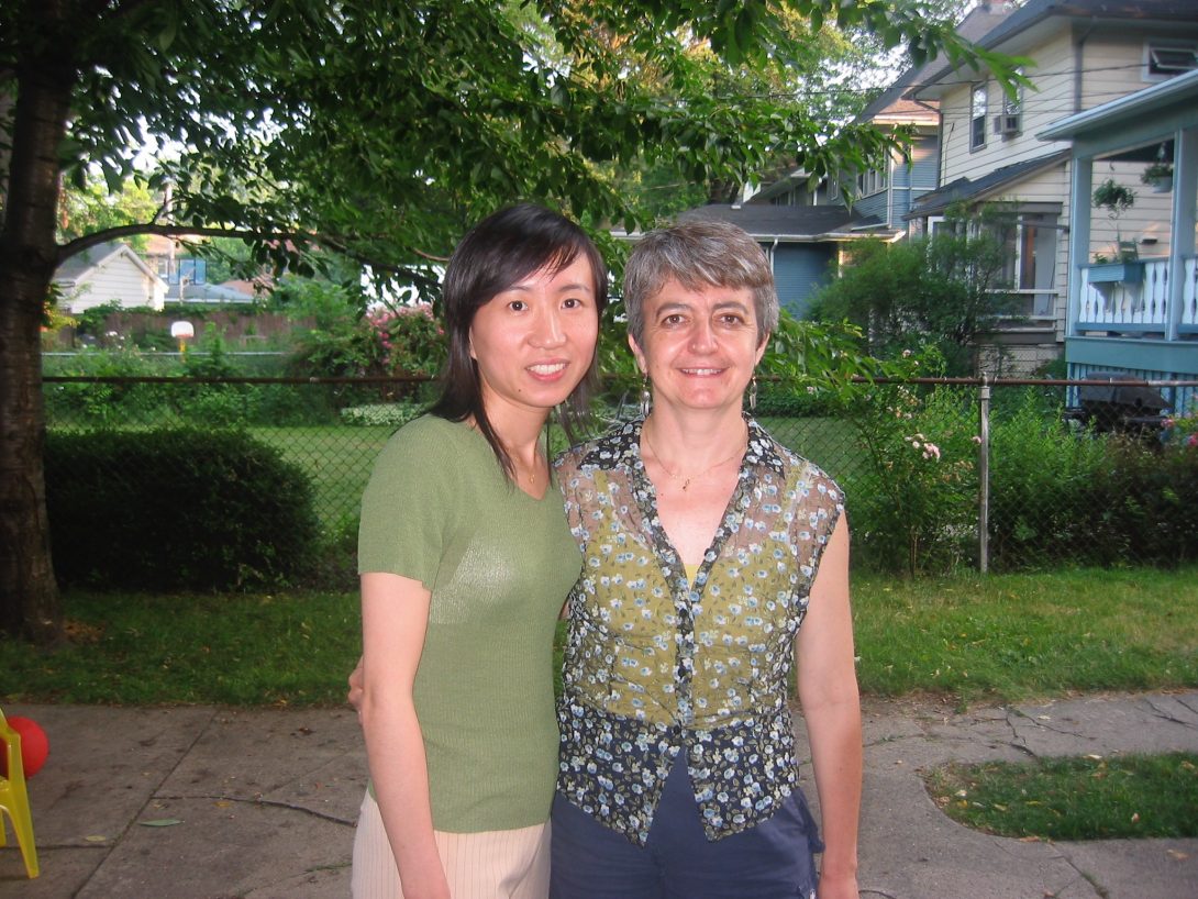 Xin Lu and Professor Di Eugenio smiling outdoors in summer attire