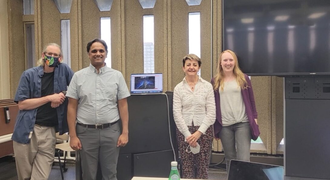 Abhinav with his committee members after his defense, three in person and two virtual