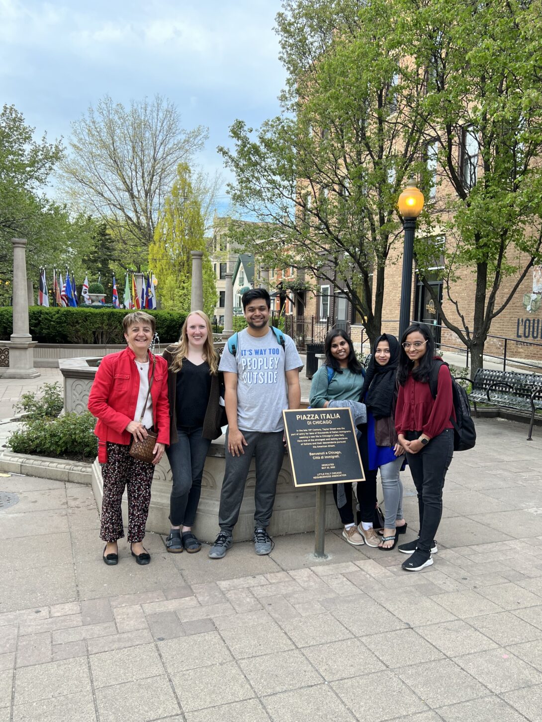 Professor Di Eugenio and Professor Parde with four NLP lab students on UIC's campus